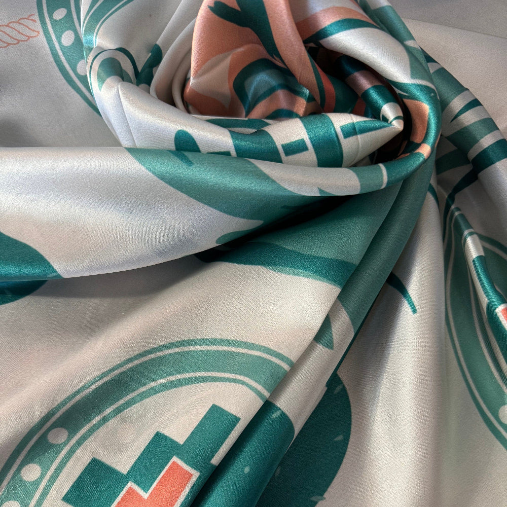 Close-up of Wild Rag 100% SILK Desert Cowgirl Cactus Cowboy Neck Scarf Bandana Double B Ivory White, light teal blue, coral pink pattern.