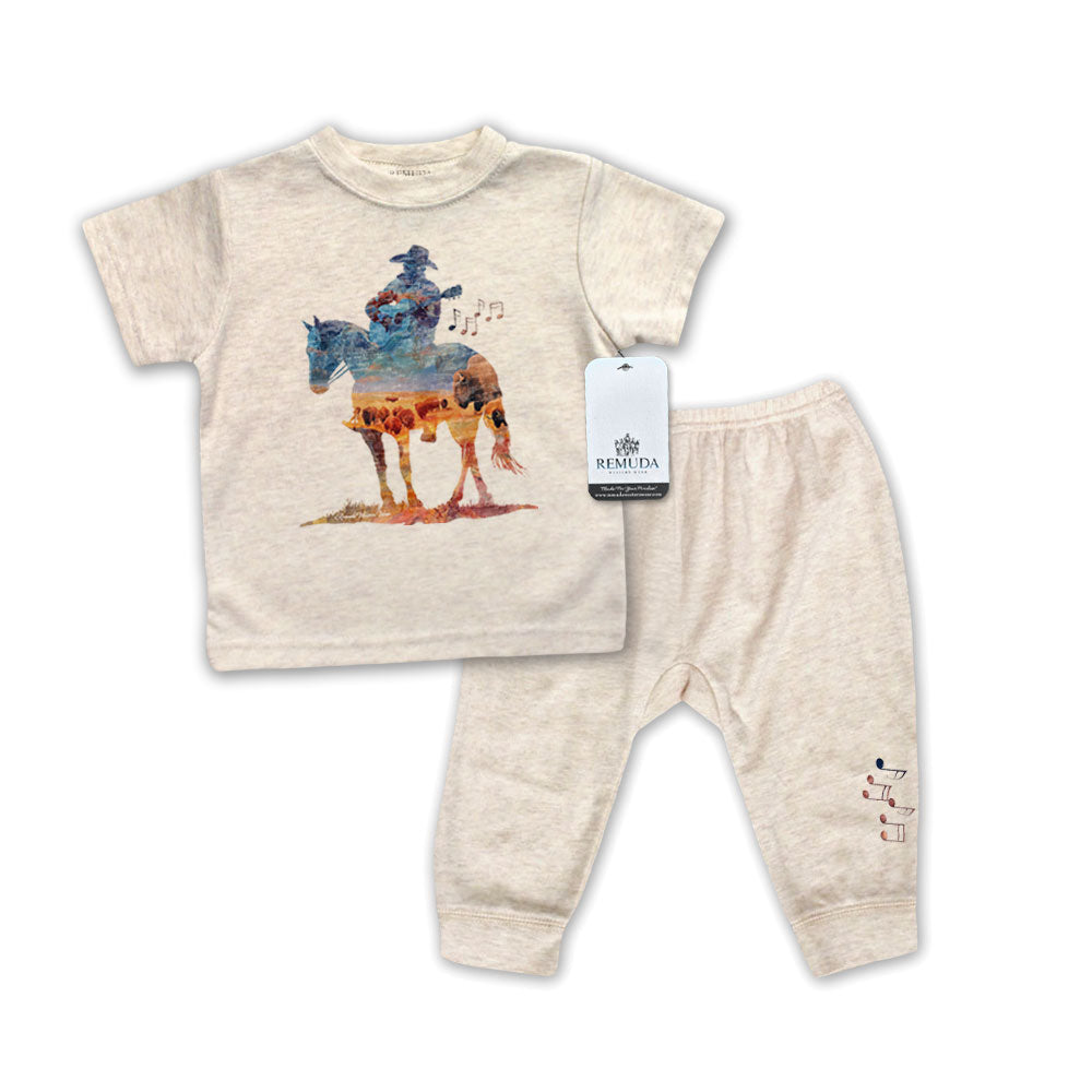 Infant 2-Piece oatmeal Sleepwear Pajamas with a watercolor-style illustration of a cowboy on horseback playing a guitar, overlaid with a herd of roaming buffalo, creating a soft, artistic western design.