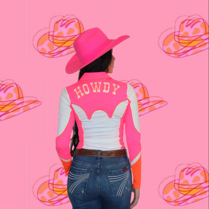 Person wearing a pink and white jacket with 'HOWDY' on the back, standing against a pink background with cowboy hat illustrations.