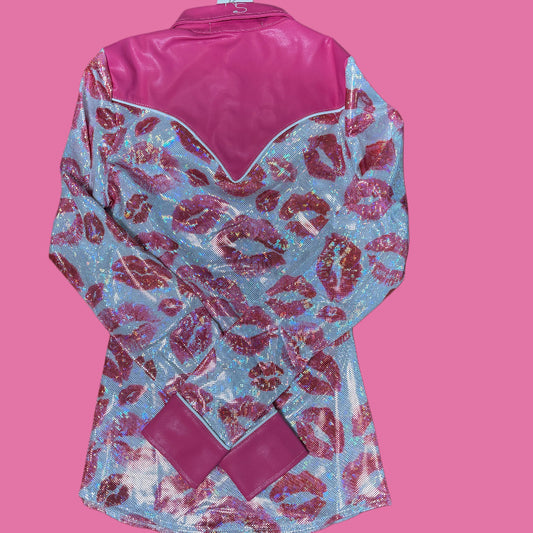 A pink and white western rodeo shirt with lips designs.