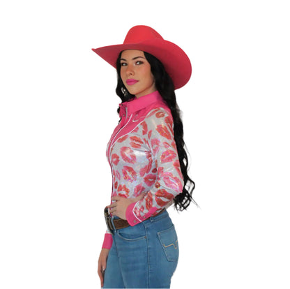 Woman wearing a pink and white patterned shirt, blue jeans, and a red cowboy hat on a white background