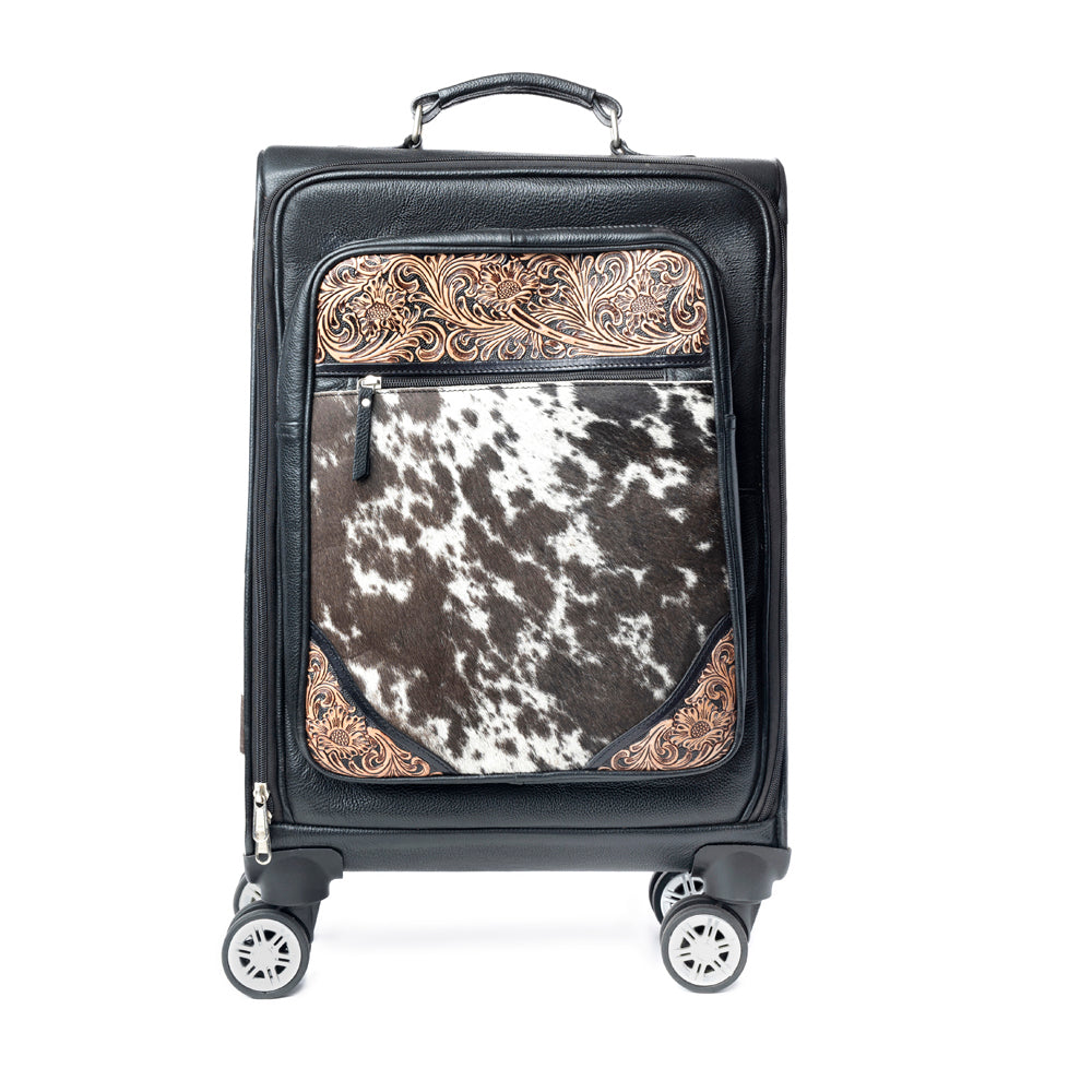 Black suitcase luggage carry on with hairon cowhide and tooled leather and decorative accents on a white background