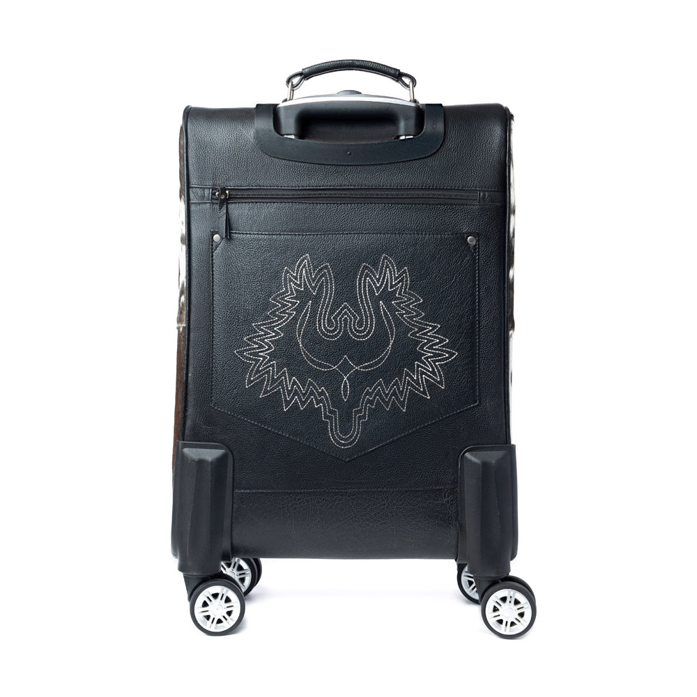 Black suitcase with hairon cowhide and tooled leather with a stitched Thunderbird pattern on the back on a white background
