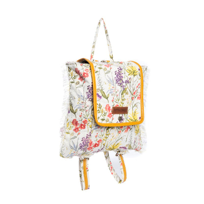 Floral-patterned backpack with leather accents on a white background