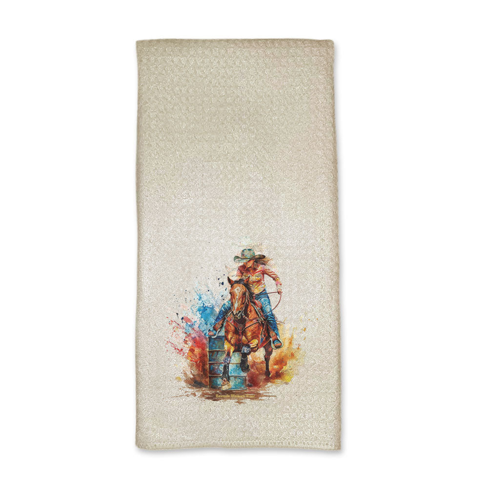 A set of vibrant western rodeo style kitchen hand towels featuring a barrel racer running around a barrel. Comes in a cream color. The design captures the spirit of rodeo and western culture.