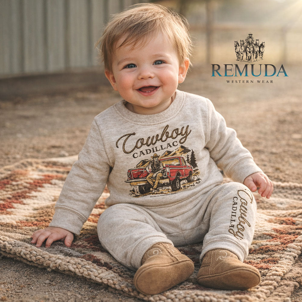 A custom two-piece infant sweatsuit featuring “Cowboy Cadillac” western graphic sweatshirt and matching jogger pants by Remuda Western Wear in Oatmeal color.