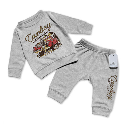 A custom two-piece infant sweatsuit featuring “Cowboy Cadillac” western graphic sweatshirt and matching jogger pants by Remuda Western Wear in Gray color.