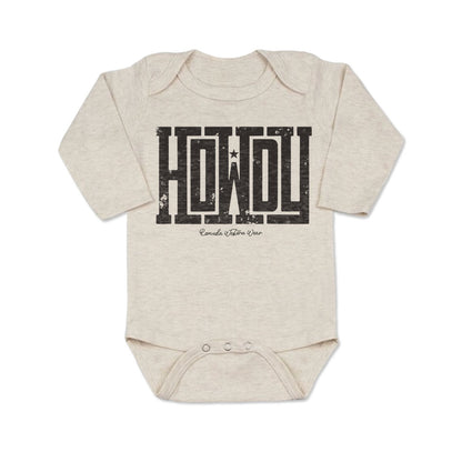 A western infant oatmeal colored long sleeve onesie with the word Howdy on the front. A great trendy onesie romper bodysuit for western wear, ranch wear, rodeo wear for any li'l cowboy or cowgirl.