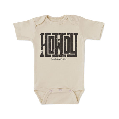 A western infant oatmeal colored short sleeve onesie with the word Howdy on the front. A great trendy onesie romper bodysuit for western wear, ranch wear, rodeo wear for any li'l cowboy or cowgirl.