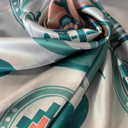 Close-up of Wild Rag 100% SILK Desert Cowgirl Cactus Cowboy Neck Scarf Bandana Double B Ivory White, light teal blue, coral pink pattern.