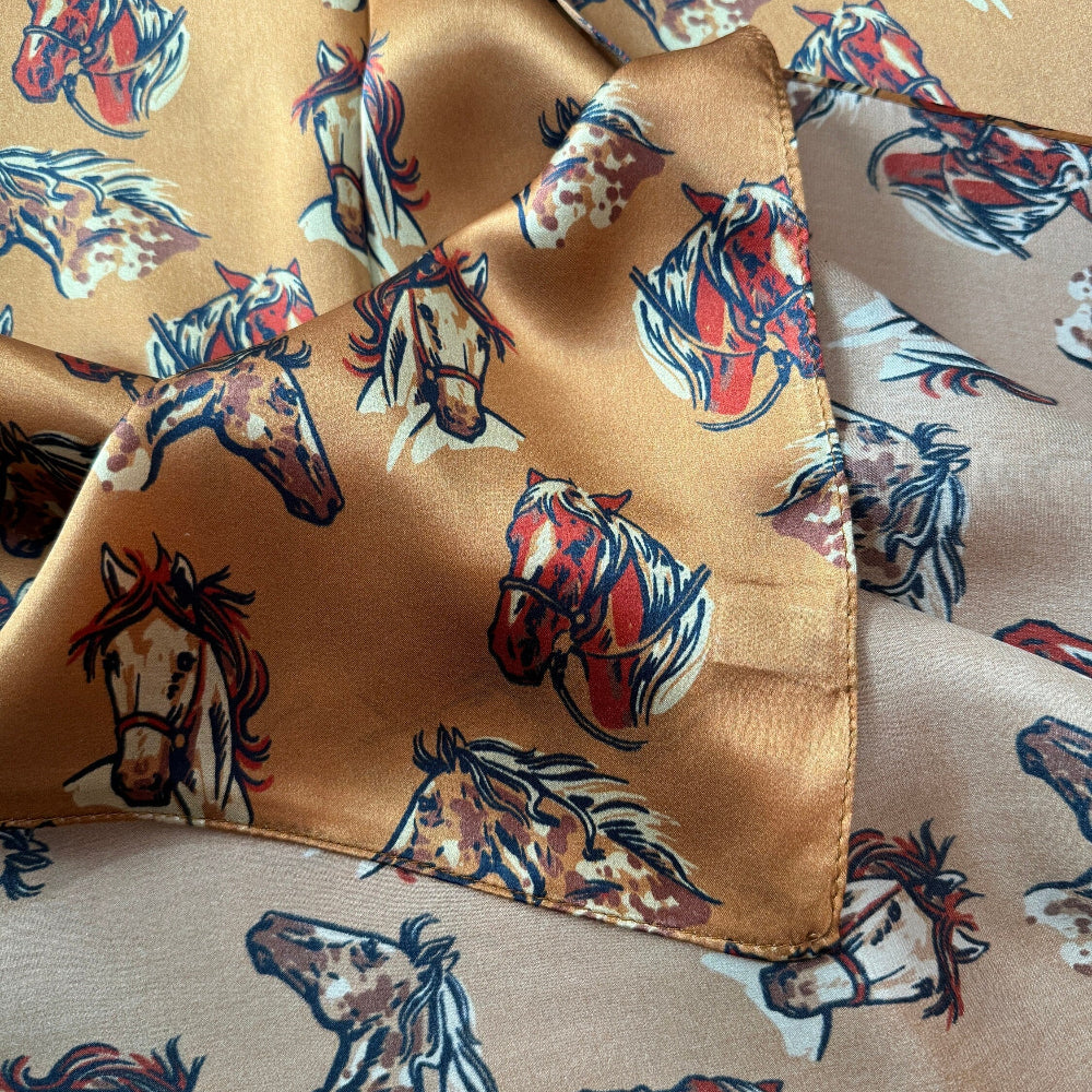 100% Silk Wild Rag Double B Neck Scarf Bandana with Hand drawn horse heads Cow Ponies scattered over a dark gold background.