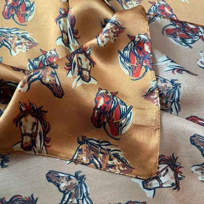 100% Silk Wild Rag Double B Neck Scarf Bandana with Hand drawn horse heads Cow Ponies scattered over a dark gold background.
