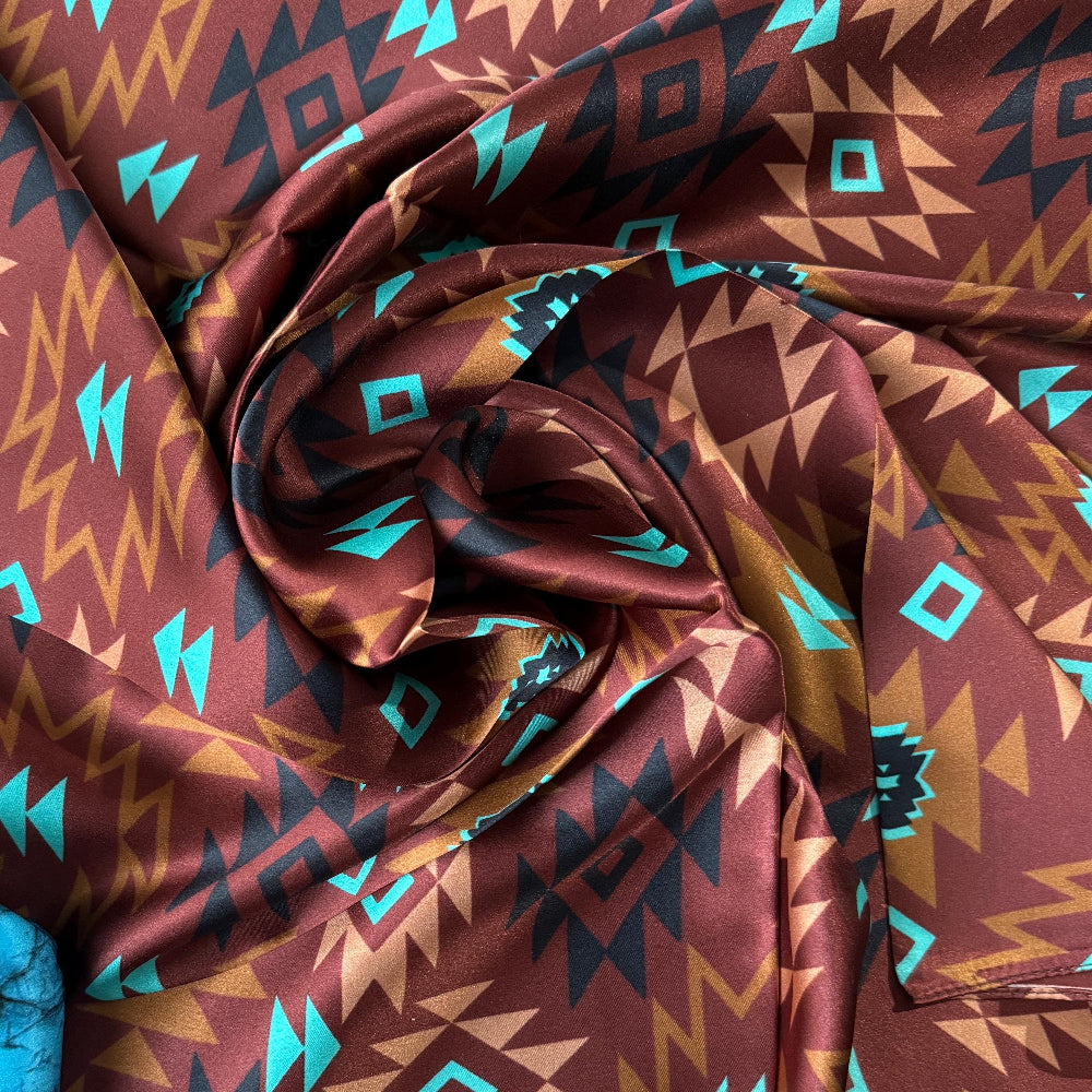 Wild Rag with geometric pattern in brown, blue, and orange.