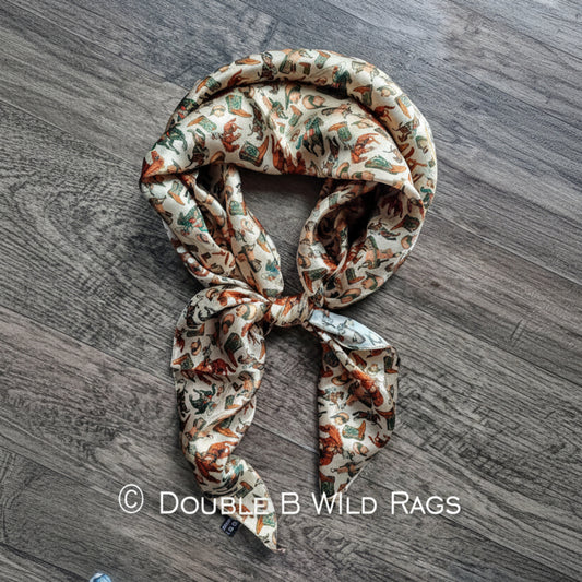 Wild Rag 100% SILK Western Cowboy Western Neck Scarf Bandana Double B Wild Rags Western Boots, Hat, Cowgirl, Bucking Horse, Cowboy with browns and dark teal on a cream background.