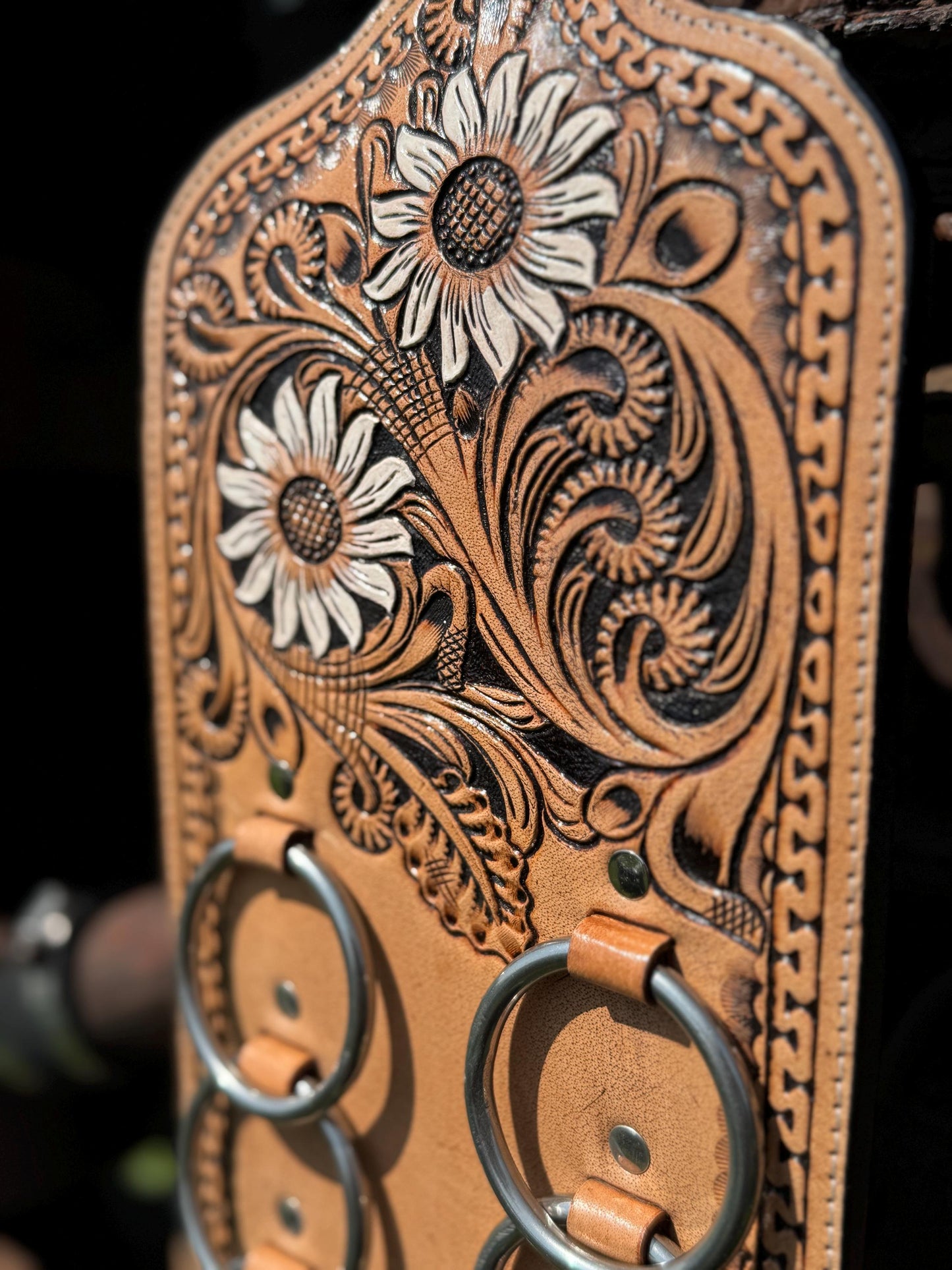 A Genuine Western Tooled Leather Floral White Sunflower Wild Rag Scarf Display Holder Keeper Close up view 