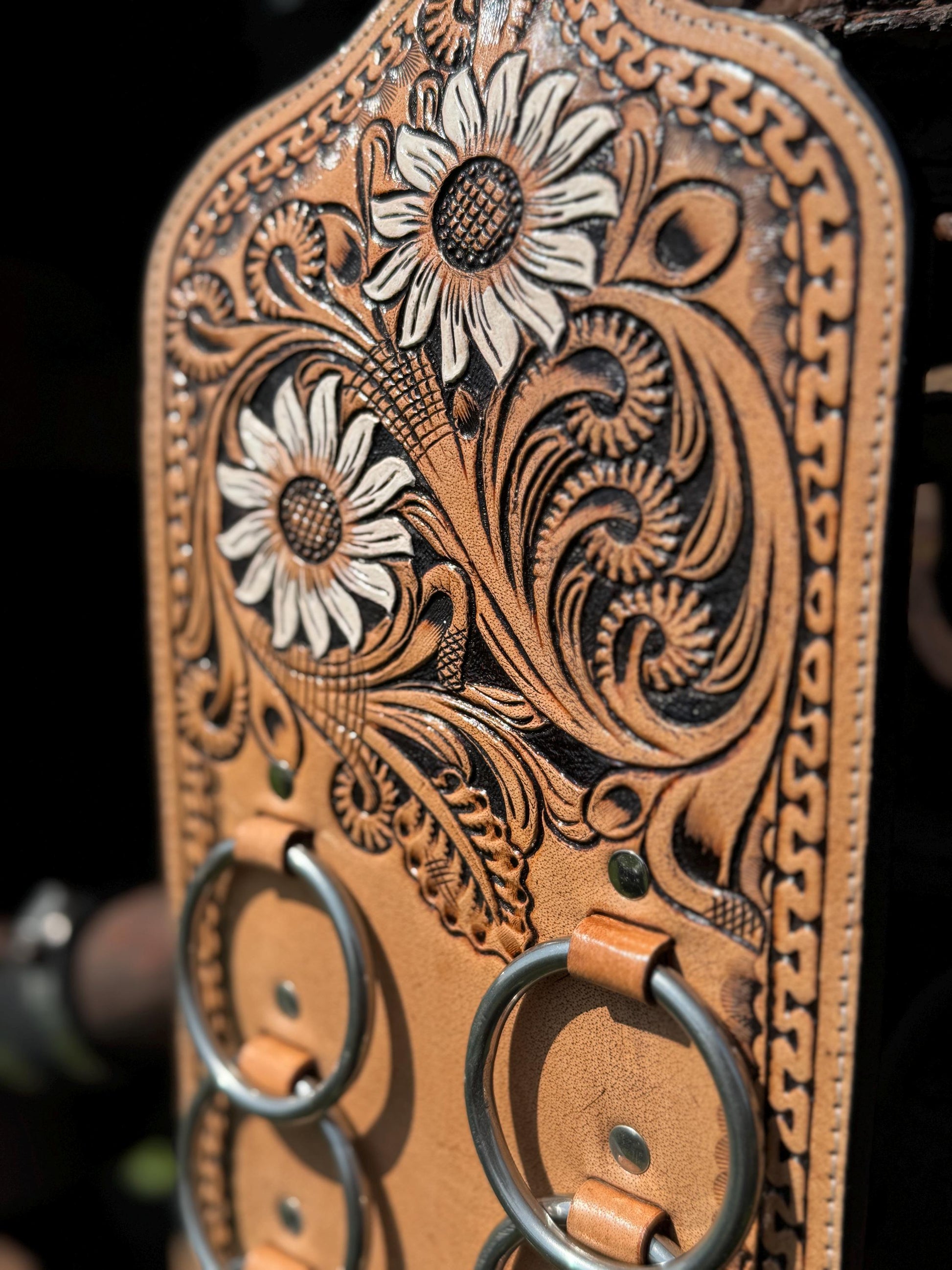 A Genuine Western Tooled Leather Floral White Sunflower Wild Rag Scarf Display Holder Keeper Close up view 
