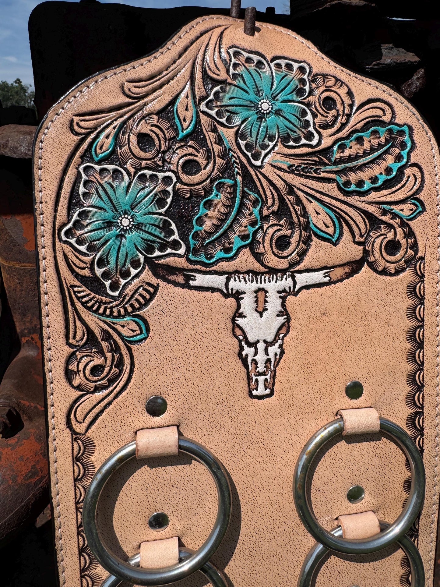 A Genuine Western Tooled Leather Turquoise Floral Cow Steer Skull Wild Rag Scarf Display Holder Keeper Close up view 
