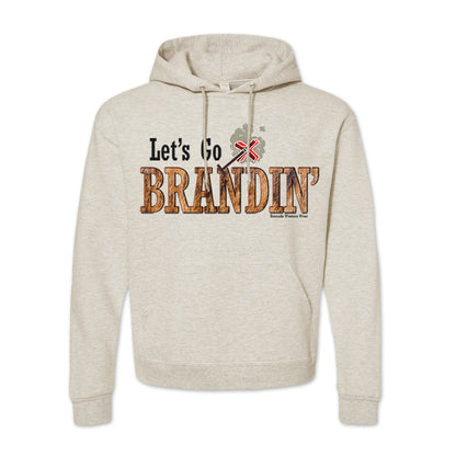 An adult vintage oatmeal colored hoodie with the phrase 'Let's Go Brandin'' printed in bold western letters across the chest. Above the text is an illustration of a classic western-style branding iron, emitting a faint glow of heat. The branding iron features a distinctive 'X' emblem, reminiscent of cattle branding. A great shirt for western wear, ranch wear, or rodeo wear.