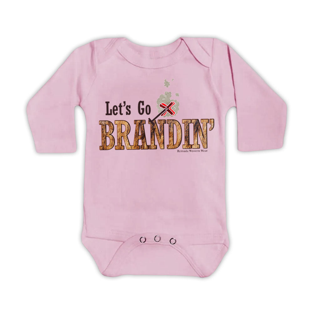 A stylish western-themed light pink colored infant long sleeve one piece romper bodysuit featuring the phrase 'Let's Go Brandin'' prominently printed in bold, weathered letters across the chest. Above the shirt is is an illustration of a branding iron, evoking a rustic cowboy aesthetic. Kids Western wear, Ranch wear and Rodeo wear.