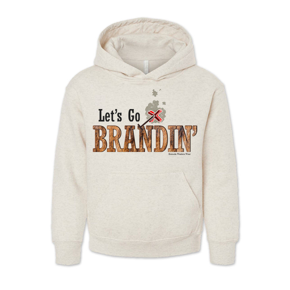 A vintage oatmeal colored youth hoodie with the phrase 'Let's Go Brandin'' printed in bold western letters across the chest. Above the text is an illustration of a classic western-style branding iron, emitting a faint glow of heat. The branding iron features a distinctive 'X' emblem, reminiscent of cattle branding. A great shirt for western wear, ranch wear, or rodeo wear.