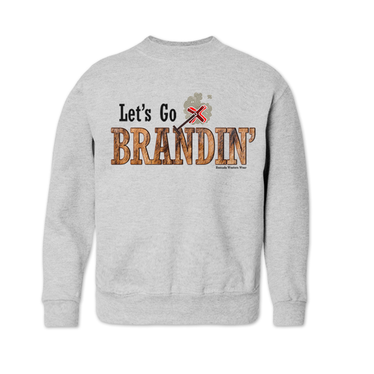 A youth vintage light ash gray colored sweatshirt with the phrase 'Let's Go Brandin'' printed in bold western letters across the chest. Above the text is an illustration of a classic western-style branding iron, emitting a faint glow of heat. The branding iron features a distinctive 'X' emblem, reminiscent of cattle branding. A great shirt for western wear, ranch wear, or rodeo wear.