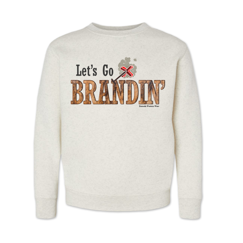 A youth vintage oatmeal colored sweatshirt with the phrase 'Let's Go Brandin'' printed in bold western letters across the chest. Above the text is an illustration of a classic western-style branding iron, emitting a faint glow of heat. The branding iron features a distinctive 'X' emblem, reminiscent of cattle branding. A great shirt for western wear, ranch wear, or rodeo wear.