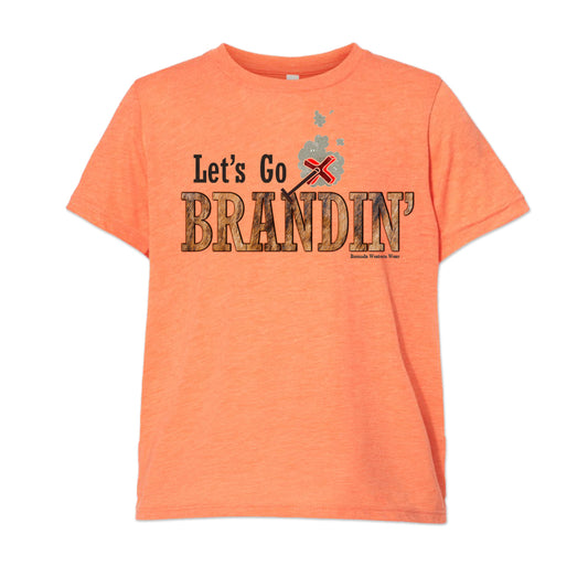 A stylish western-themed orange colored youth t-shirt featuring the phrase 'Let's Go Brandin'' prominently printed in bold, weathered letters across the chest. Above the shirt is is an illustration of a branding iron, evoking a rustic cowboy aesthetic. Kids Western wear, Ranch wear and Rodeo wear.