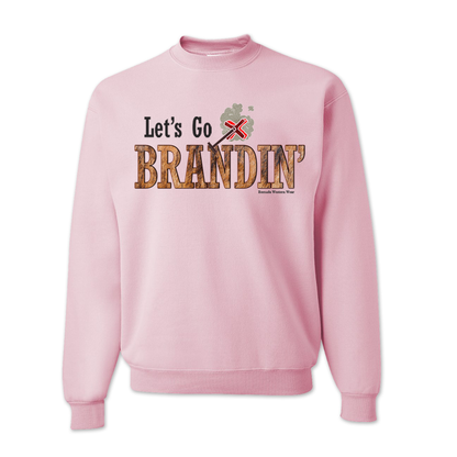 An adult vintage light pink colored sweatshirt with the phrase 'Let's Go Brandin'' printed in bold western letters across the chest. Above the text is an illustration of a classic western-style branding iron, emitting a faint glow of heat. The branding iron features a distinctive 'X' emblem, reminiscent of cattle branding. A great shirt for western wear, ranch wear, or rodeo wear.