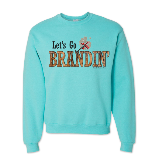 An adult turquoise colored sweatshirt with the phrase 'Let's Go Brandin'' printed in bold western letters across the chest. Above the text is an illustration of a classic western-style branding iron, emitting a faint glow of heat. The branding iron features a distinctive 'X' emblem, reminiscent of cattle branding. A great shirt for western wear, ranch wear, or rodeo wear.