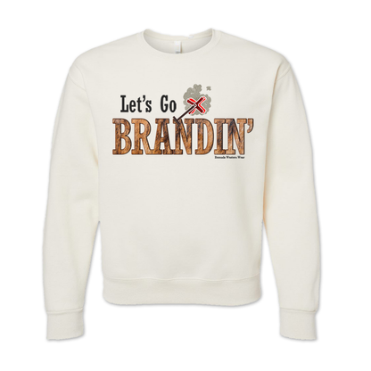 An adult vintage sweet cream heather colored sweatshirt with the phrase 'Let's Go Brandin'' printed in bold western letters across the chest. Above the text is an illustration of a classic western-style branding iron, emitting a faint glow of heat. The branding iron features a distinctive 'X' emblem, reminiscent of cattle branding. A great shirt for western wear, ranch wear, or rodeo wear.