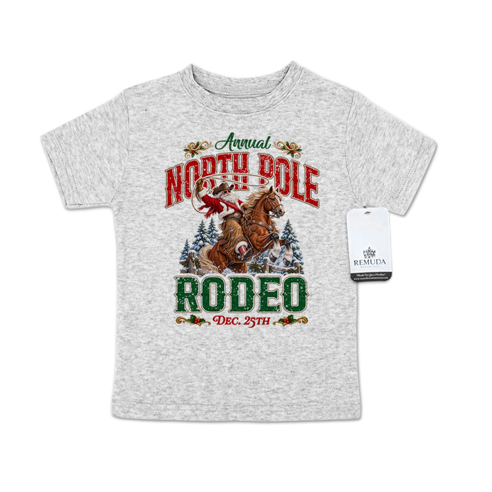 Heather gray toddler short sleeve T-shirt featuring a festive North Pole Rodeo Christmas design with Cowboy Santa riding a rearing horse, snowy pine trees, vintage red and green rodeo lettering, and December 25th details.