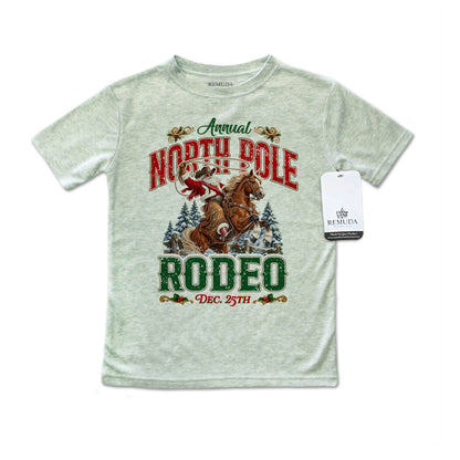 Heather sage green toddler short sleeve T-shirt featuring a festive North Pole Rodeo Christmas design with Cowboy Santa riding a rearing horse, snowy pine trees, vintage red and green rodeo lettering, and December 25th details.