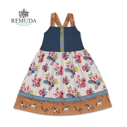 Girls western "Petals & Ponies" floral dress with a navy bodice with yellow buttons, soft wildflower skirt, running horse hem, and crossed back straps.