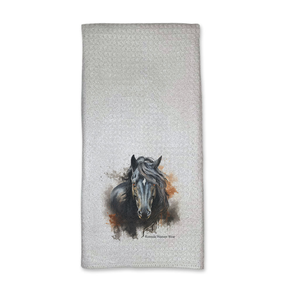 A vibrant western ranch style kitchen hand towel featuring a a stunning black stallion with vibrant orange and dark gray grunge style designs around him. Comes in a white color. The design captures the spirit of western culture.