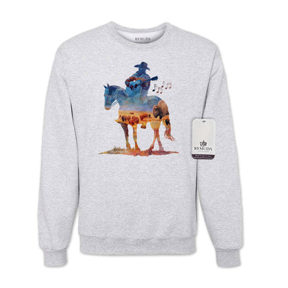 Watercolor illustration of a cowboy riding a horse while playing a guitar, featured on an ash gray unisex Western-style sweatshirt with a soft, artistic design.