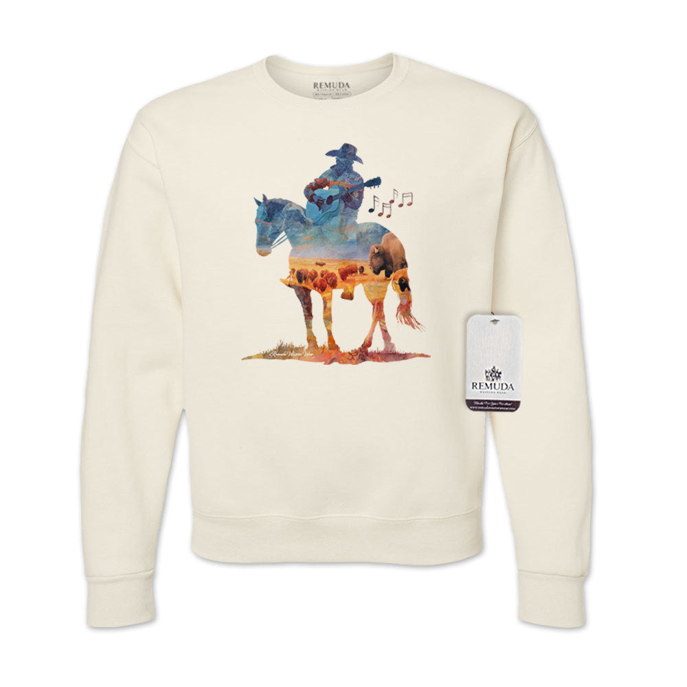 Watercolor illustration of a cowboy riding a horse while playing a guitar, featured on an oatmeal unisex Western-style sweatshirt with a soft, artistic design.