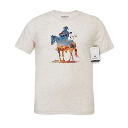 Watercolor-style illustration on a western oatmeal colored t-shirt showing a cowboy on horseback playing a guitar, with a soft, artistic western aesthetic titled “Where The Buffalo Roam.”