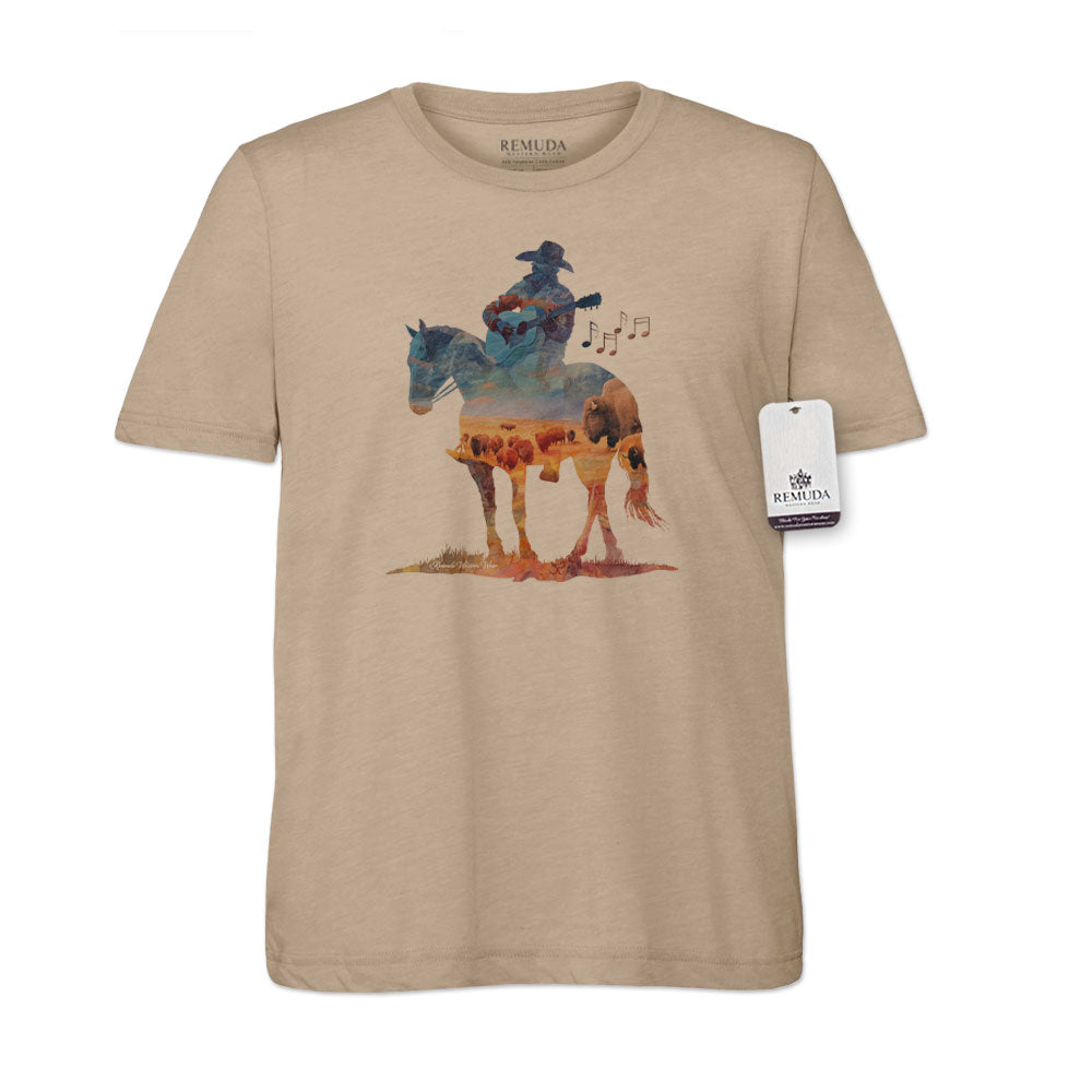 Watercolor-style illustration on a western solid tan colored t-shirt showing a cowboy on horseback playing a guitar, with a soft, artistic western aesthetic titled “Where The Buffalo Roam.”