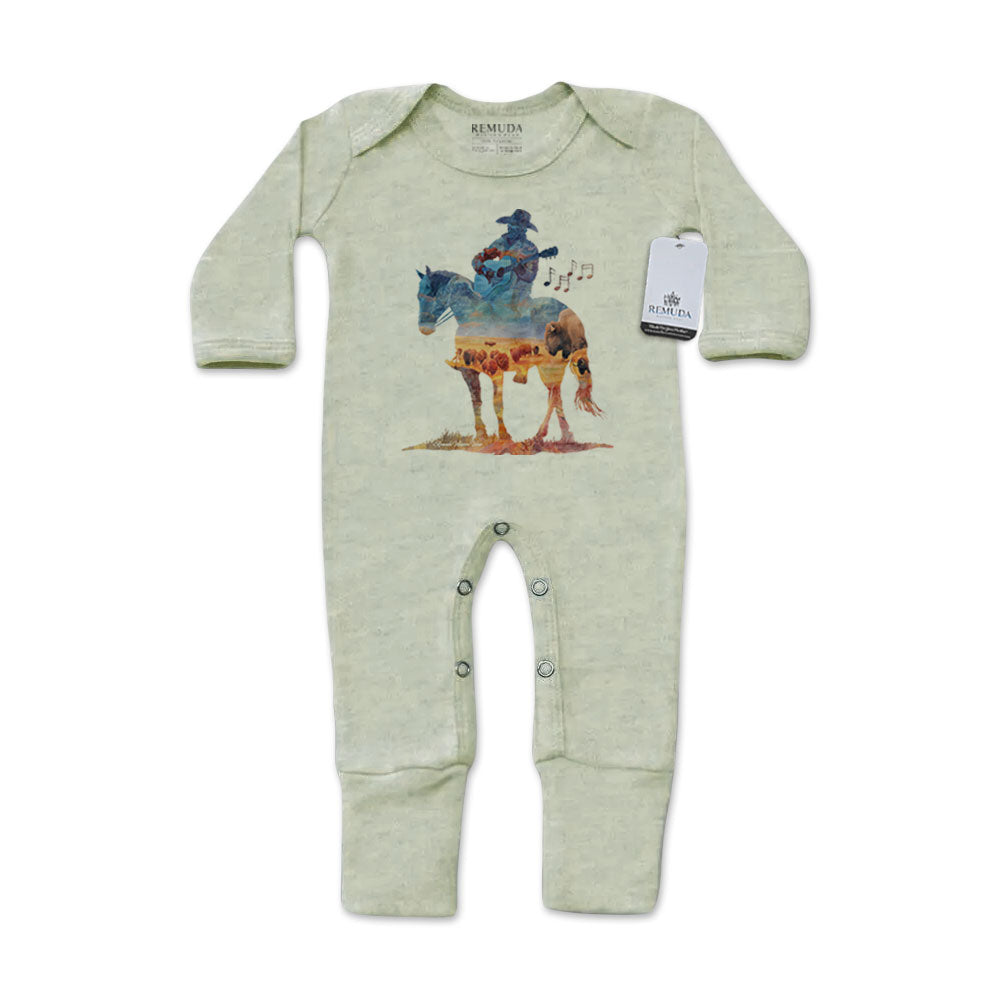 Infant one-piece footed sage green colored sleepwear with built-in mittens featuring a watercolor-style design of a cowboy on horseback playing a guitar, titled “Where The Buffalo Roam,” in a soft, artistic western theme.