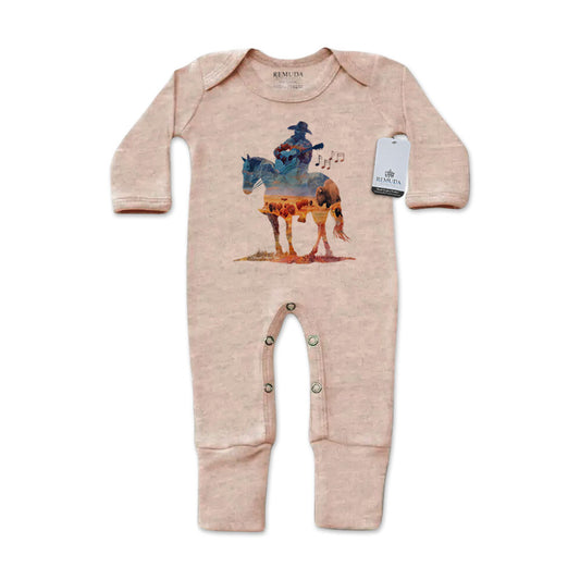 Infant one-piece footed sandstone colored sleepwear with built-in mittens featuring a watercolor-style design of a cowboy on horseback playing a guitar, titled “Where The Buffalo Roam,” in a soft, artistic western theme.