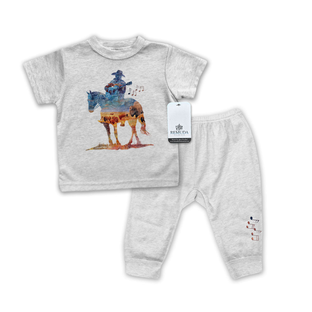 Infant 2-Piece gray Sleepwear Pajamas with a watercolor-style illustration of a cowboy on horseback playing a guitar, overlaid with a herd of roaming buffalo, creating a soft, artistic western design.