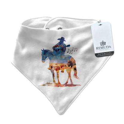 Infant/toddler white bandana bib with a watercolor-style illustration of a cowboy on horseback playing a guitar, overlaid with a herd of roaming buffalo, creating a soft, artistic western design.