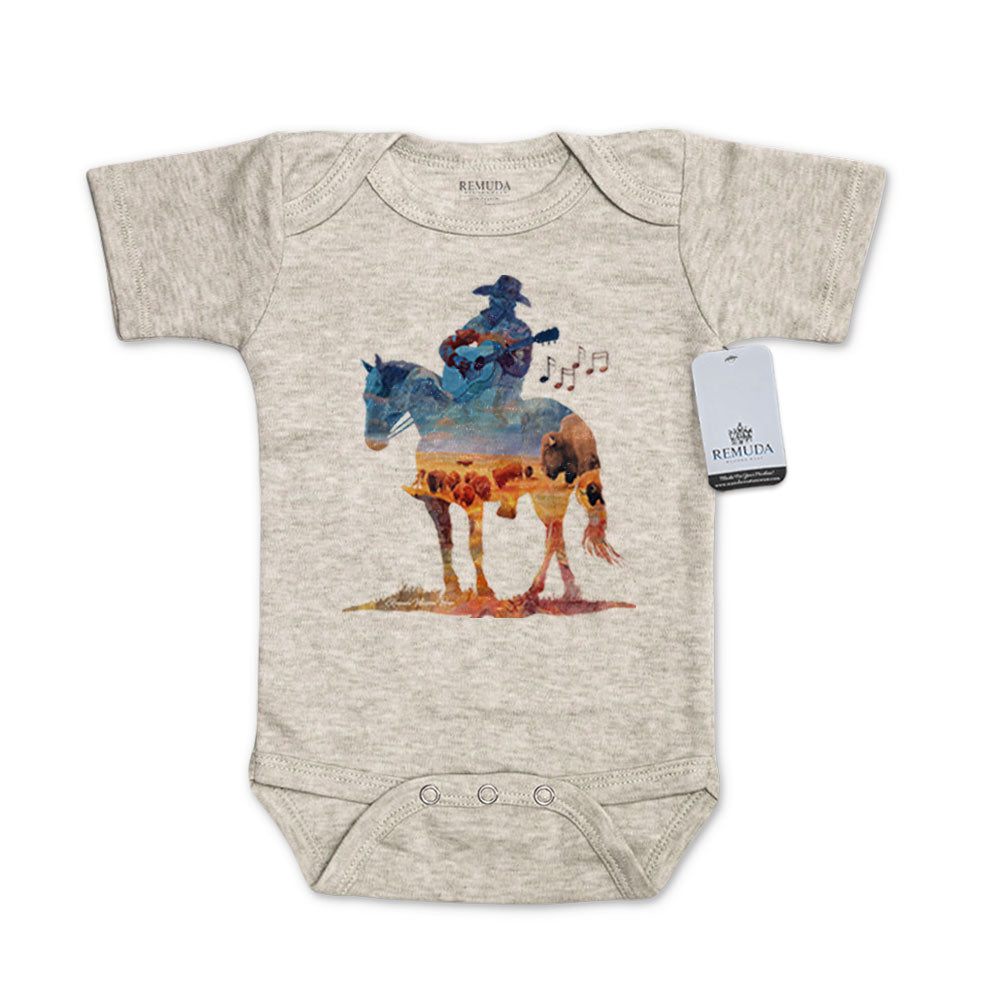 Infant western one piece short sleeve oatmeal romper featuring a watercolor-style illustration of a cowboy on horseback playing a guitar, with a soft, artistic western design.
