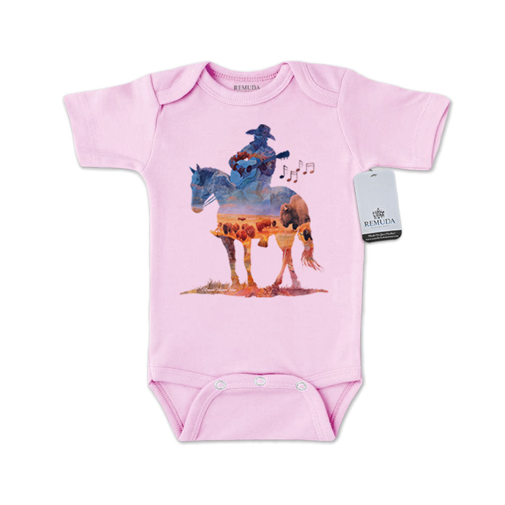 Infant western one piece short sleeve pink romper featuring a watercolor-style illustration of a cowboy on horseback playing a guitar, with a soft, artistic western design.