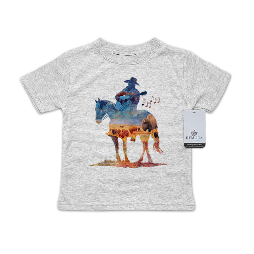 Watercolor-style western illustration on an infant heather gray color t-shirt featuring a cowboy on horseback playing a guitar, with a soft, artistic “Where The Buffalo Roam” overlay design.