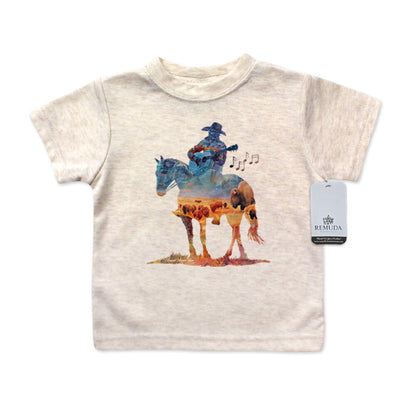 Watercolor-style western illustration on an infant oatmeal color t-shirt featuring a cowboy on horseback playing a guitar, with a soft, artistic “Where The Buffalo Roam” overlay design.