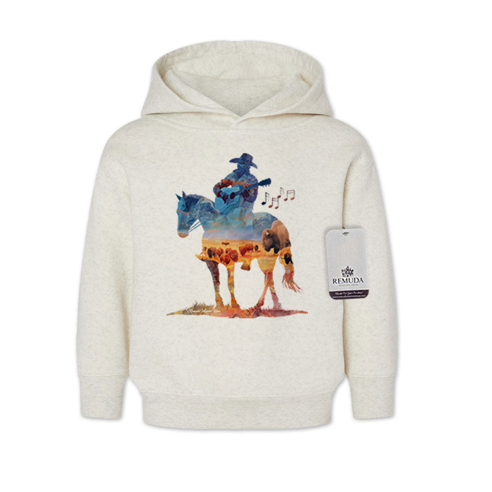 Watercolor-style illustration on an oatmeal toddler pullover hoodie showing a cowboy on horseback playing a guitar, titled “Where The Buffalo Roam,” in a playful western design.