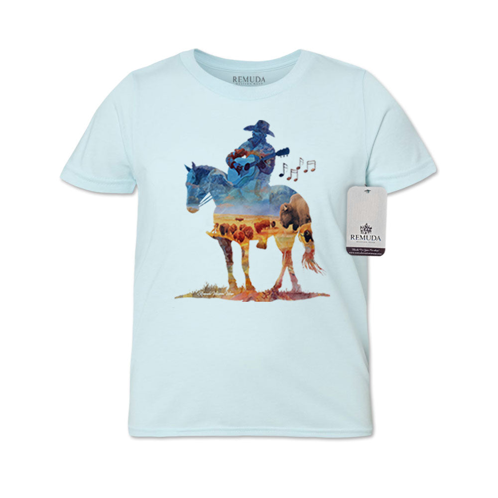 Watercolor-style youth light blue color t-shirt design showing a cowboy on horseback playing a guitar with a semi-transparent buffalo herd overlay, titled “Where The Buffalo Roam.”